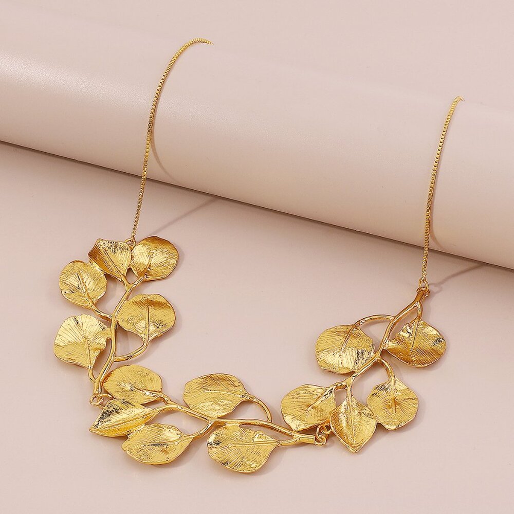 18K GOLD DIPPED BIB NECKLACE A CASCADE OF LEAVES ON YOUR CHEST.